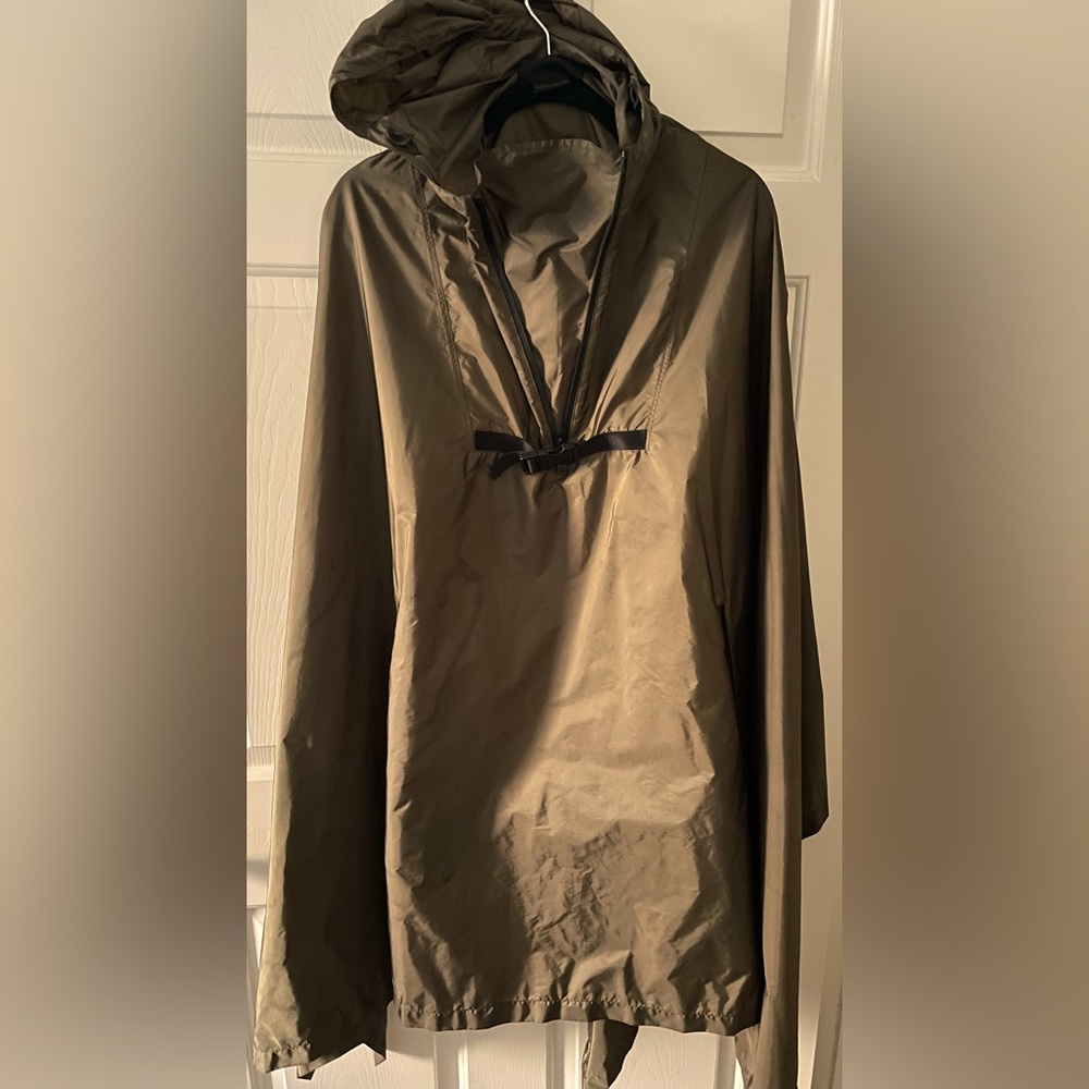 Prada Raincoat that transforms into a carry bag.